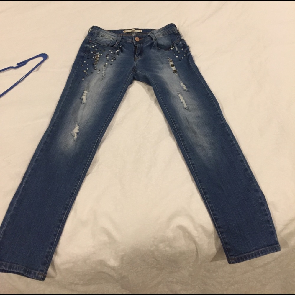 Distressed and beaded size 30 waist cropped jeans.